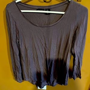 Loose fitting grey sweatshirt. Soft/stretchy material